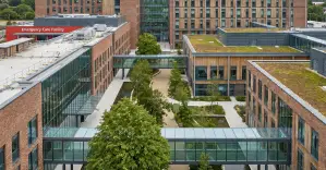 Modern brick and glass building campus with sky bridges